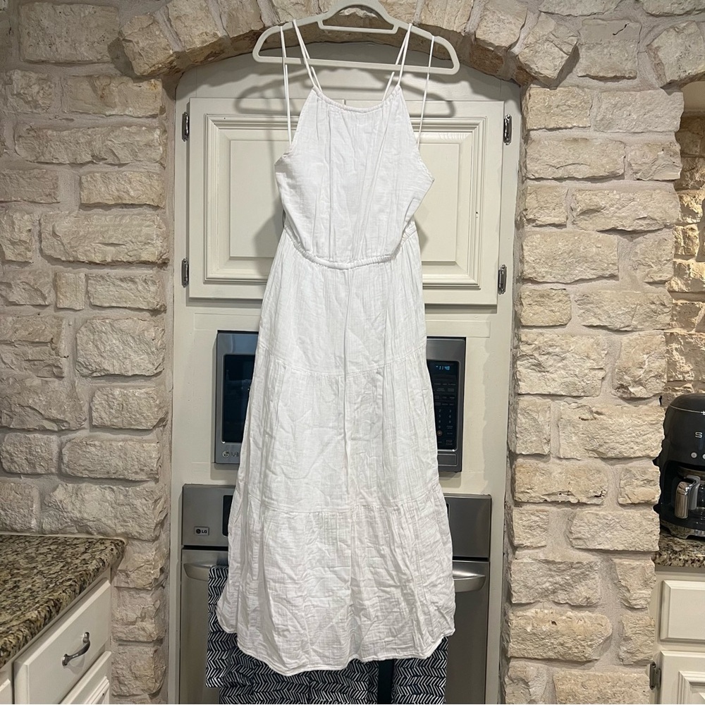 Flowy White Maxi Dress with Pockets, Adjustable Straps, and Cutout Detail